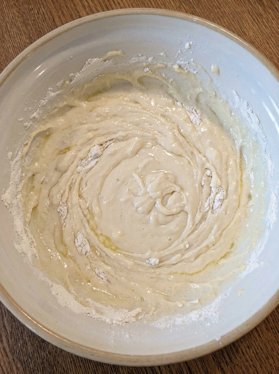 Thick muffin batter mixed for Bakery Style Blueberry Muffins
