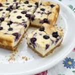 Blueberry Cream Cheese Bars baked until lightly golden and sliced with creamy filling and blueberries on top