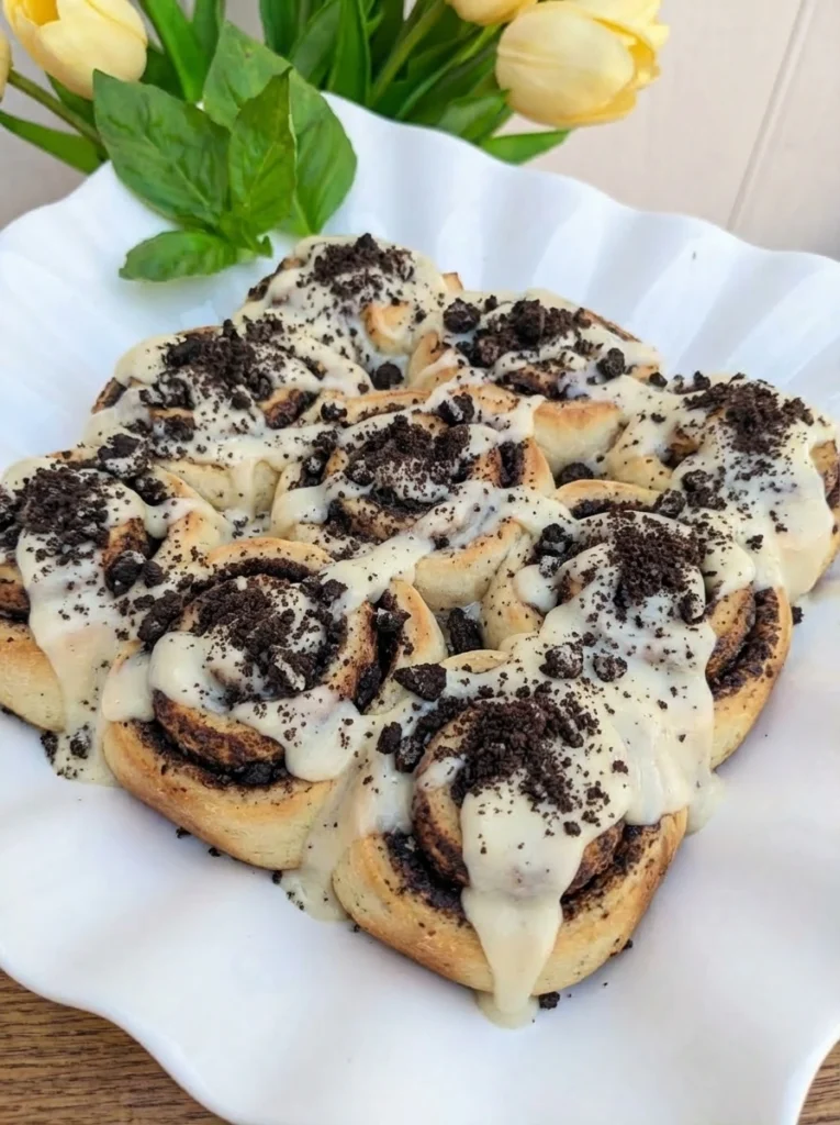 Cookies and Cream Cinnamon Rolls baked until lightly golden with cream cheese frosting and cookie crumbs.