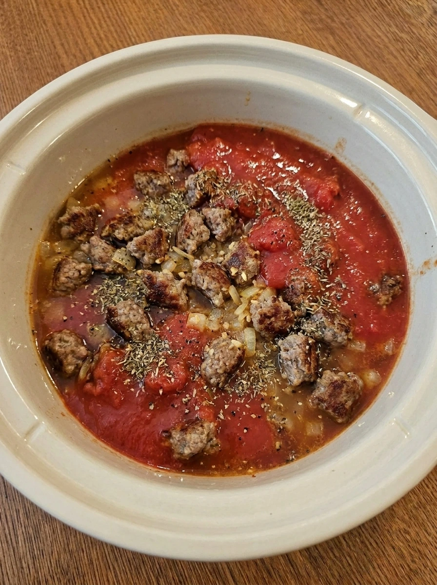 Sausage and tomato sauce base in crockpot