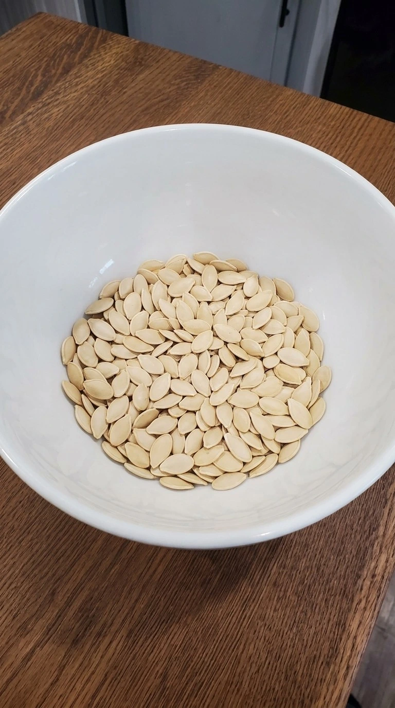 Lemon Roasted Pumpkin Seeds step showing clean pale pumpkin seeds rinsed and dried before seasoning Recipe focus: spicy lemon roasted pumpkin seeds.