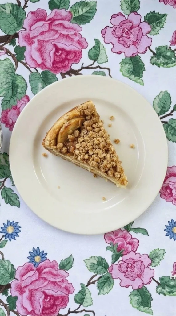 Apple Crisp Cheesecake with golden crumble topping and apple layers Recipe focus: apple crisp cheesecake recipe.