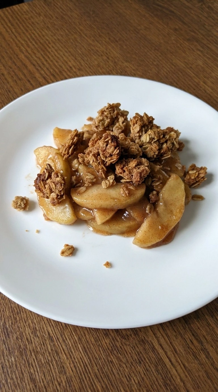 Apple Crisp with Oatmeal Crumble served warm with tender apple slices and jagged golden oat clusters Recipe focus: quick apple crisp.