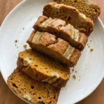 Banana Pumpkin Bread sliced loaf showing golden crust and moist pumpkin banana crumb Recipe focus: banana pumpkin bread recipe.