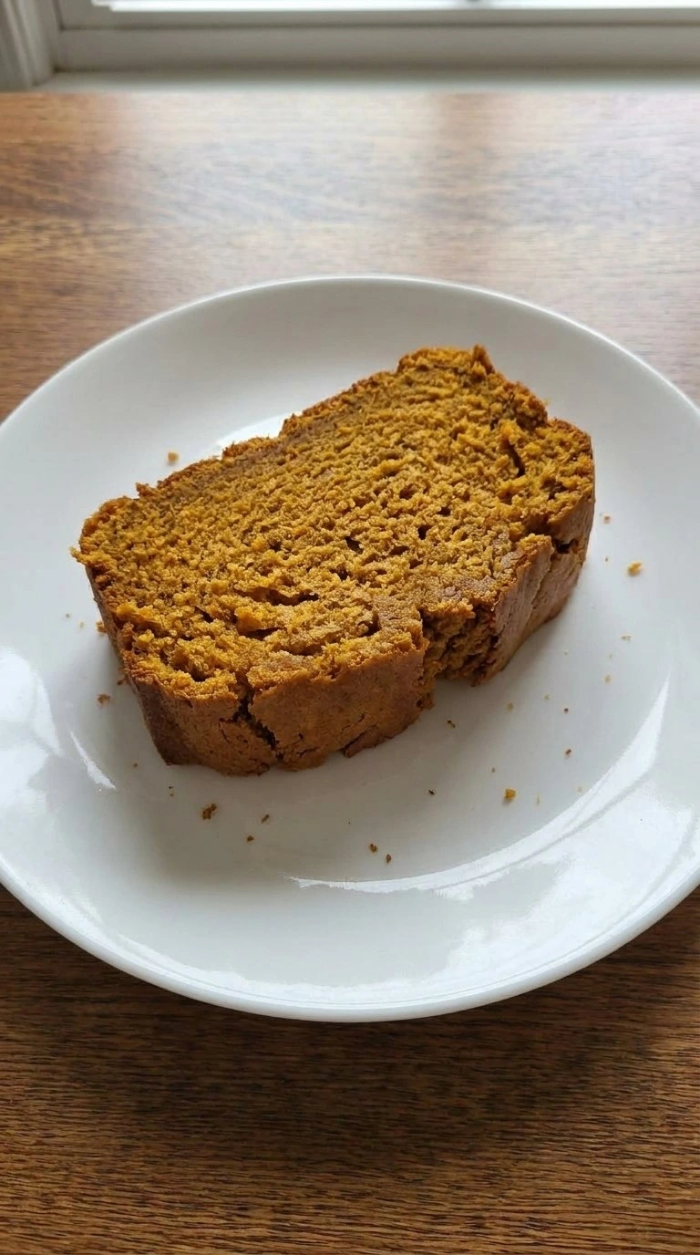 Cake Mix Pumpkin Bread sliced portion showing moist orange crumb Recipe focus: pumpkin bread using yellow cake.