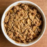 Crockpot Apple Crisp with Pie Filling served with golden oat topping and tender apples. Recipe focus: crock pot apple crisp with pie filling.