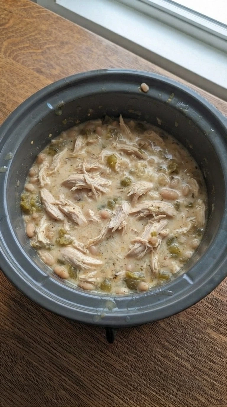 Crockpot White Chicken Chili step 3 with shredded chicken and creamy broth Recipe focus: chicken chili recipe.