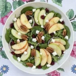 Fall Apple Salad with Honeycrisp apples, greens, toasted pecans, cranberries and goat cheese Recipe focus: apple fall salad.