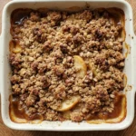 Fall Desserts Apple crisp with golden oat topping and bubbling cinnamon apples in a square baking dish Recipe focus: fall apple desserts.