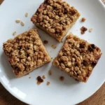 Fall Desserts for People Who Hate Pumpkin shown as golden apple cider crumb bars with visible cinnamon apple layers.