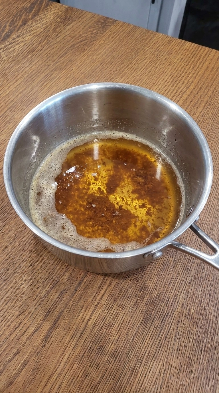 Fall Desserts for People Who Hate Pumpkin step 1 showing brown the butter to chestnut for apple cider crumb bars.