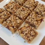 Fall Desserts with Apple Pie Filling baked as golden oat crumble bars with soft cinnamon apple layers