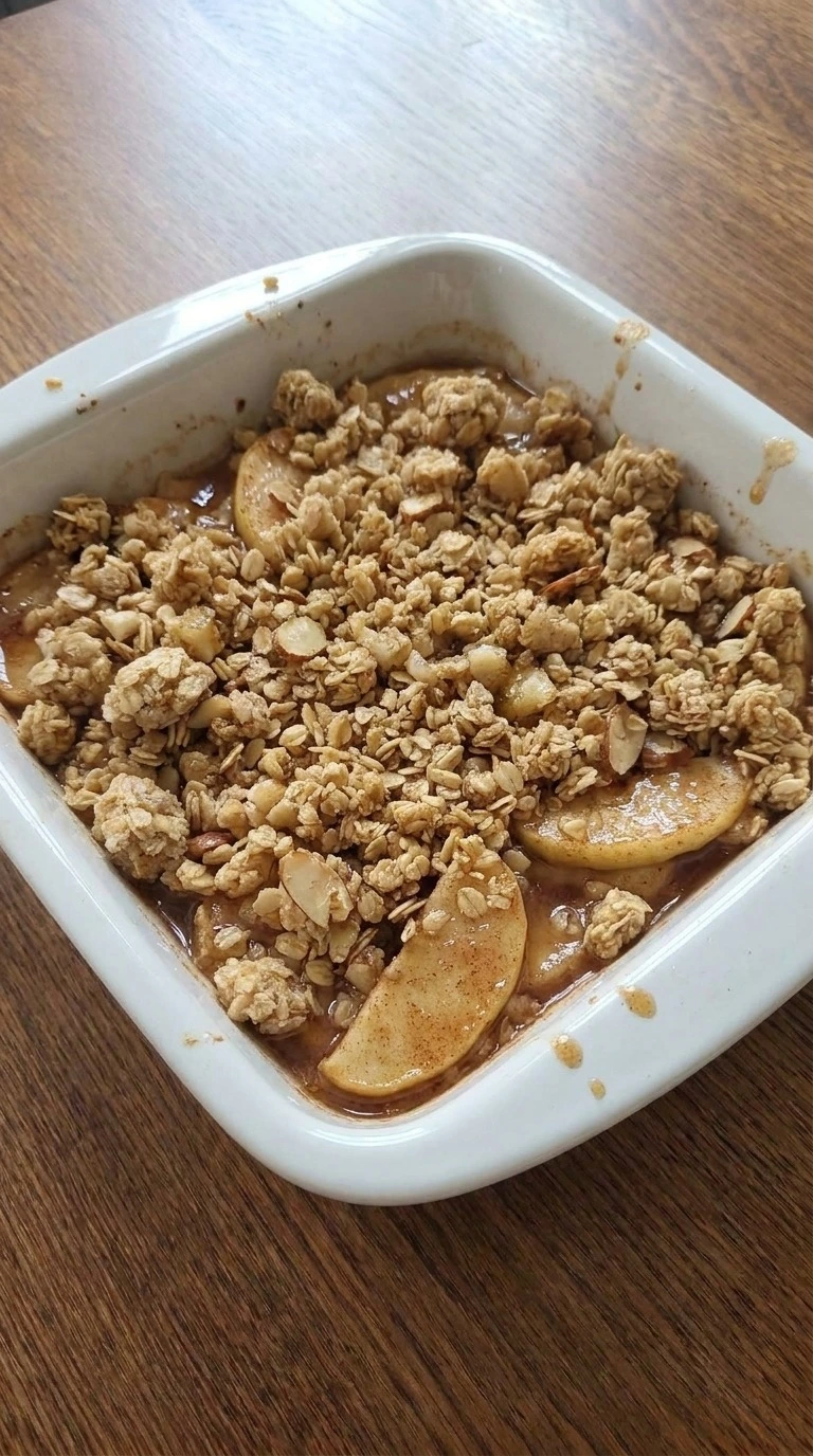 Gluten Free Apple Crisp Almond Flour assembled with apple filling and uneven almond oat crumble