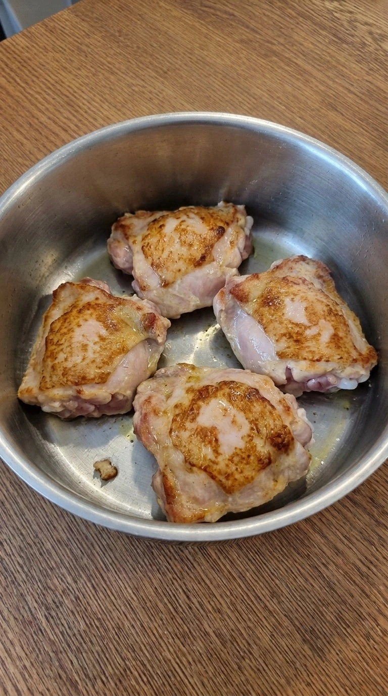 Browning chicken thighs for Gluten Free Chicken Noodle Soup until golden at the edges