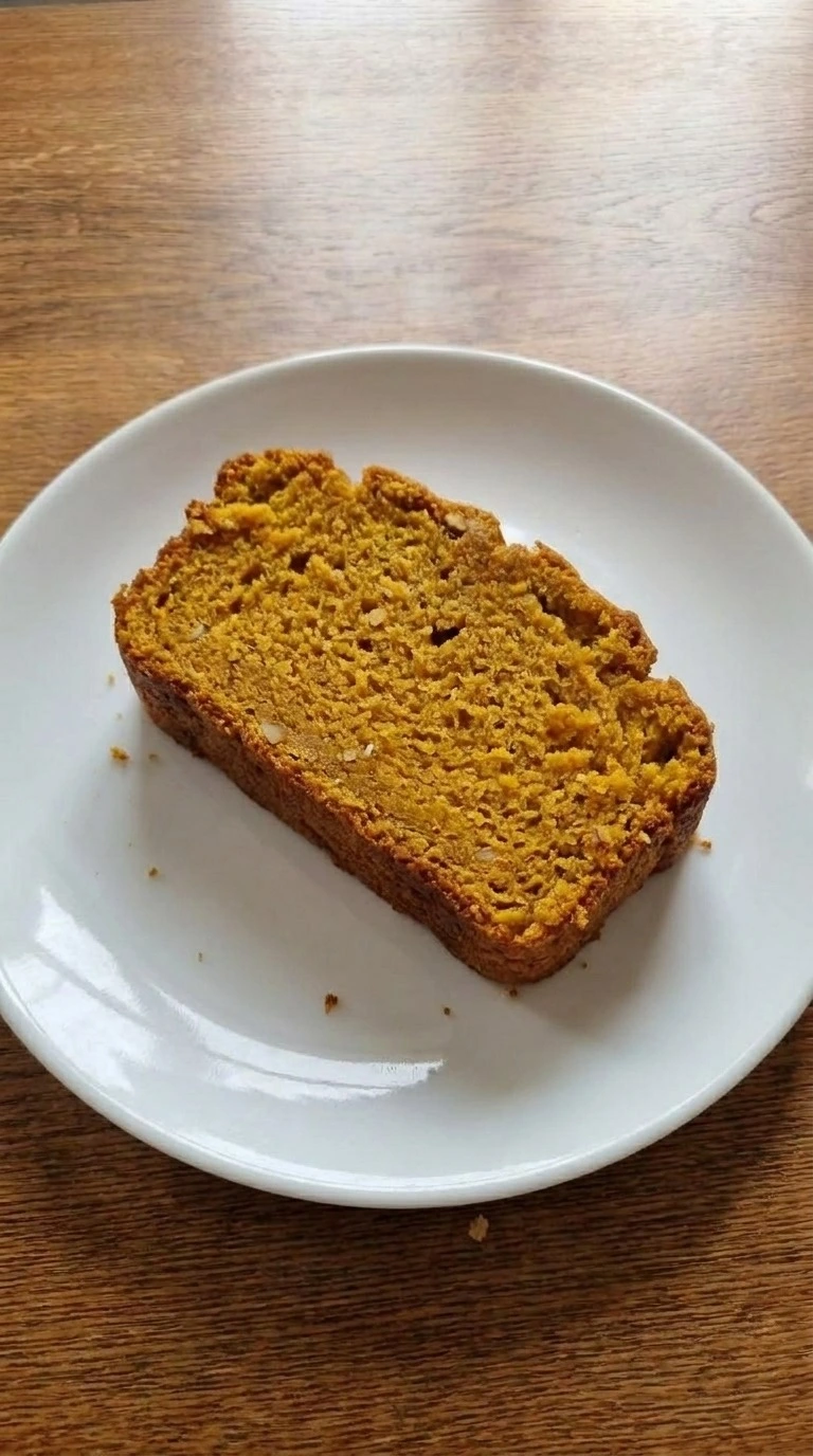 Gluten Free Pumpkin Bread Almond Flour step 5: single slice showing the moist orange crumb.