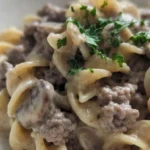 Ground Beef Stroganoff with creamy mushroom sauce and browned beef in a serving bowl Recipe focus: beef stroganoff recipe.