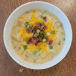 Loaded Baked Potato Soup in a bowl with bacon cheddar and potato pieces Recipe focus: potato soup recipe.
