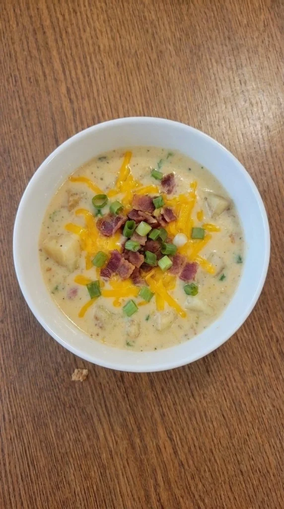 Loaded Baked Potato Soup in a bowl with bacon cheddar and potato pieces Recipe focus: potato soup recipe.