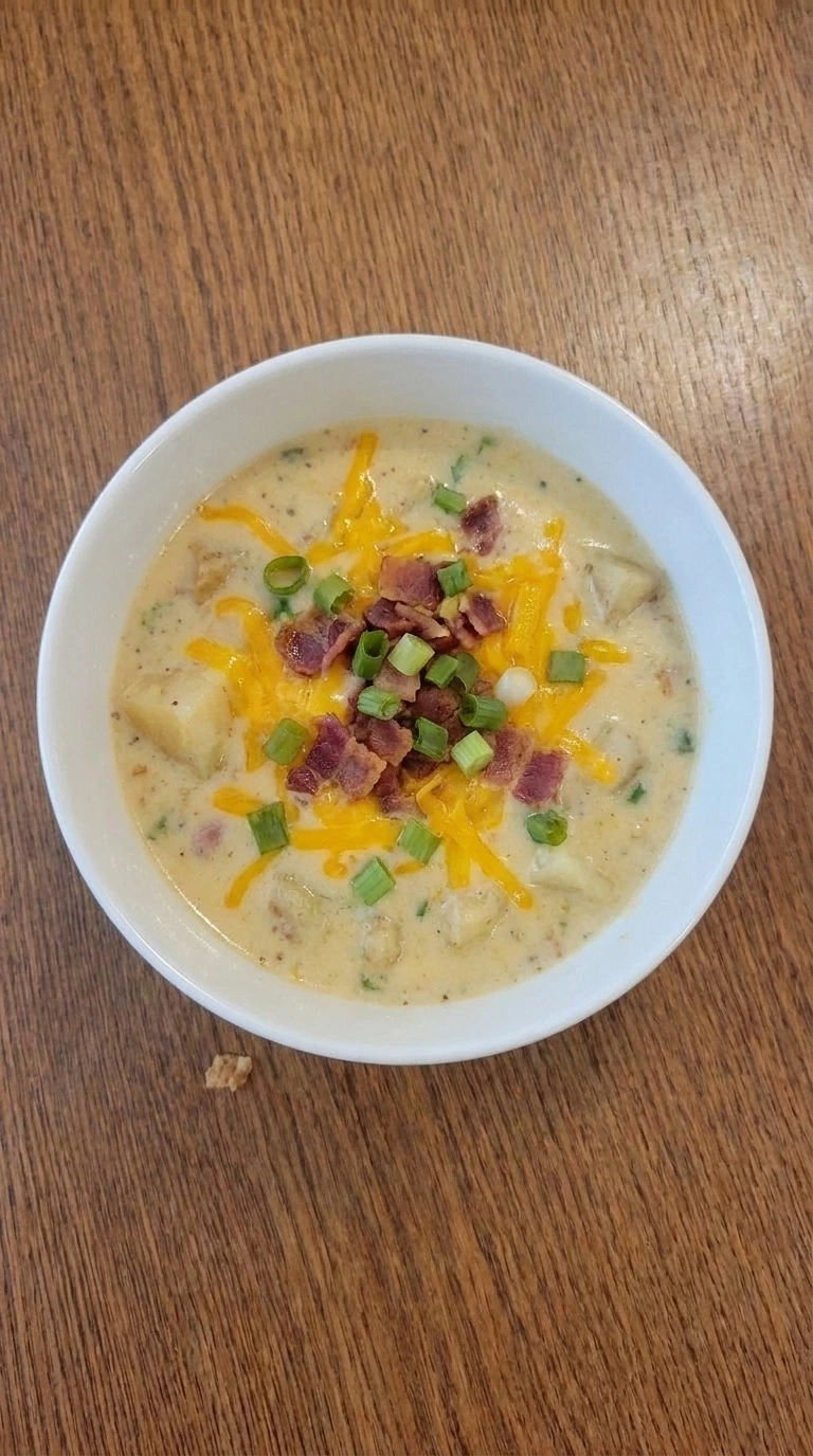 Loaded Baked Potato Soup in a bowl with bacon cheddar and potato pieces Recipe focus: potato soup recipe.