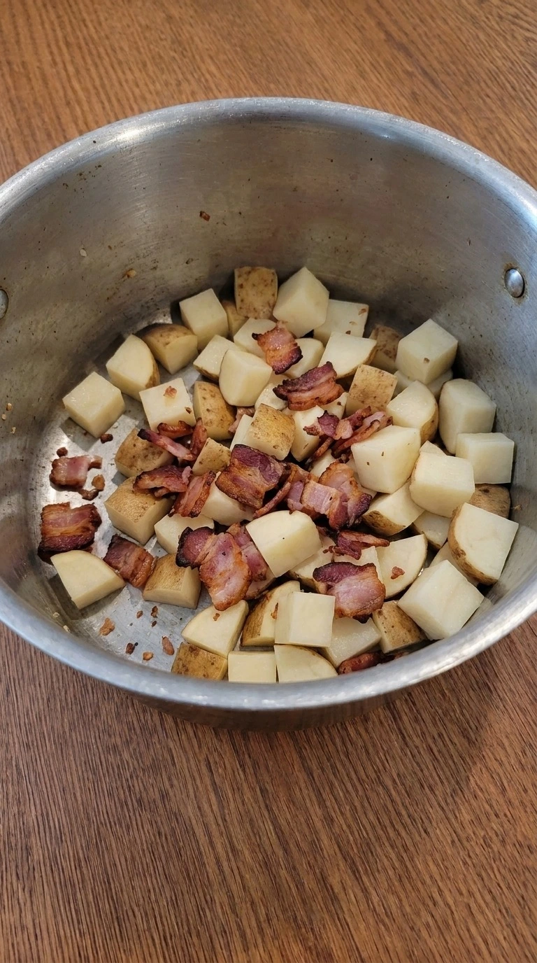 Loaded Baked Potato Soup preparation with cubed russet potatoes and bacon Recipe focus: potato bacon soup.