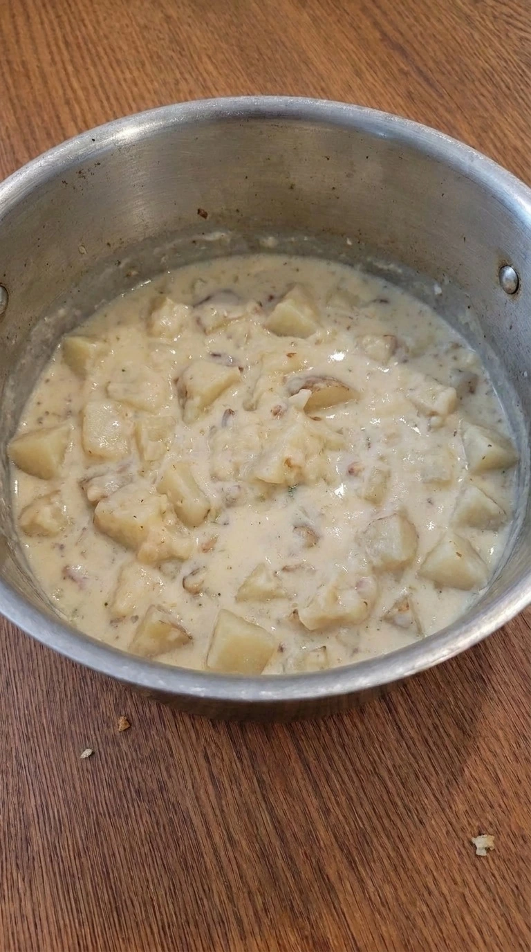 Loaded Baked Potato Soup becoming creamy with mashed potato texture Recipe focus: potato soup recipe.