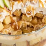 Carmel Apple Trifle Fall Desserts with cinnamon apples, vanilla cake, whipped cream and caramel in a glass bowl