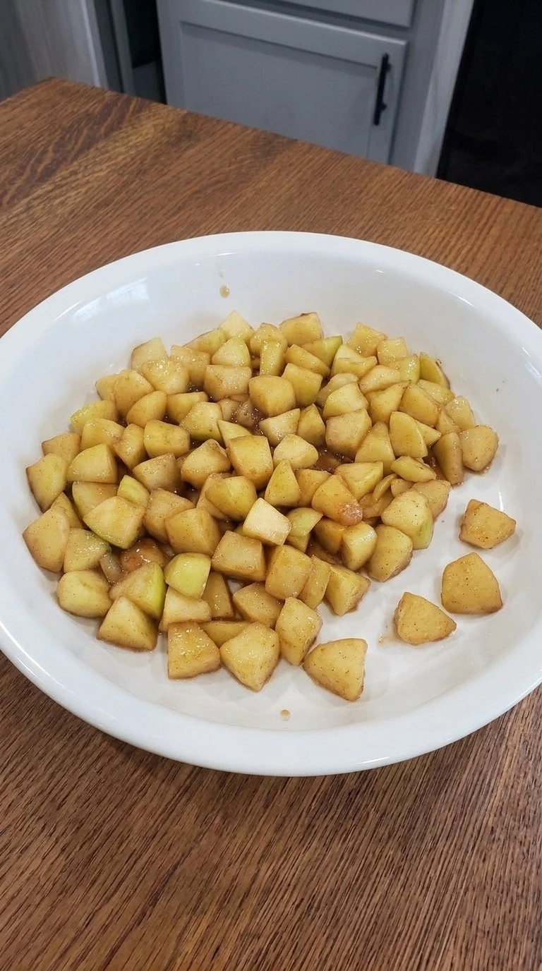 Cooled golden cinnamon apple filling for Carmel Apple Trifle Fall Desserts in a shallow dish