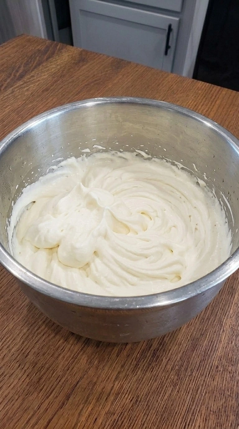 Fluffy vanilla whipped cream with soft peaks for Carmel Apple Trifle Fall Desserts