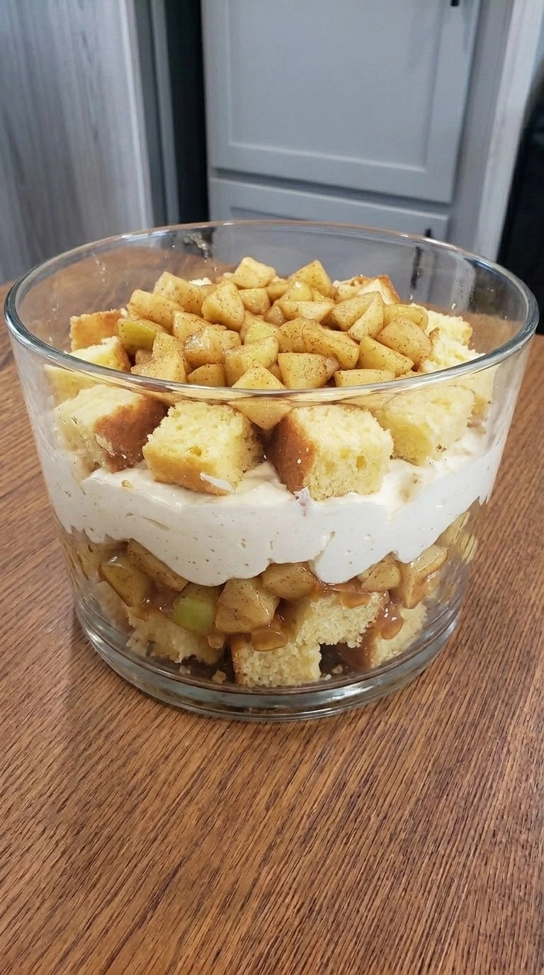 Vanilla pound cake and cinnamon apple layers forming inside Carmel Apple Trifle Fall Desserts