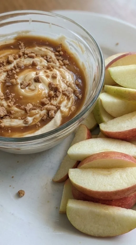 Cream Cheese Caramel Apple Dip with caramel layers and apple slices served fresh Recipe focus: caramel apple cheesecake dip.