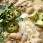 Creamy White Chicken Chili with tender shredded chicken, cannellini beans, green chiles and fresh cilantro. Recipe focus: crockpot white chicken chili.