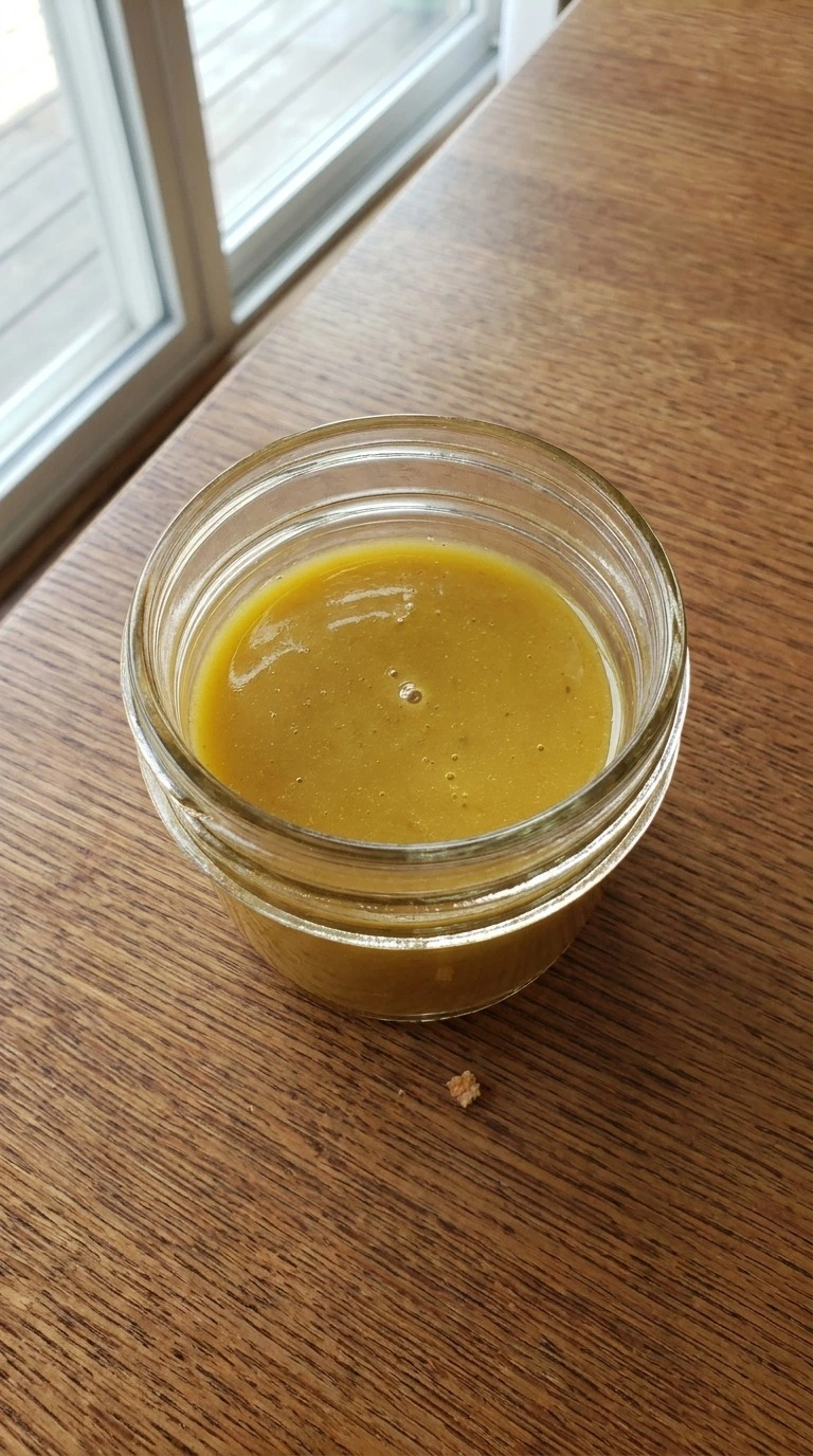 Fall Harvest Salad maple dressing whisked smooth in a small bowl Recipe focus: fall salad.