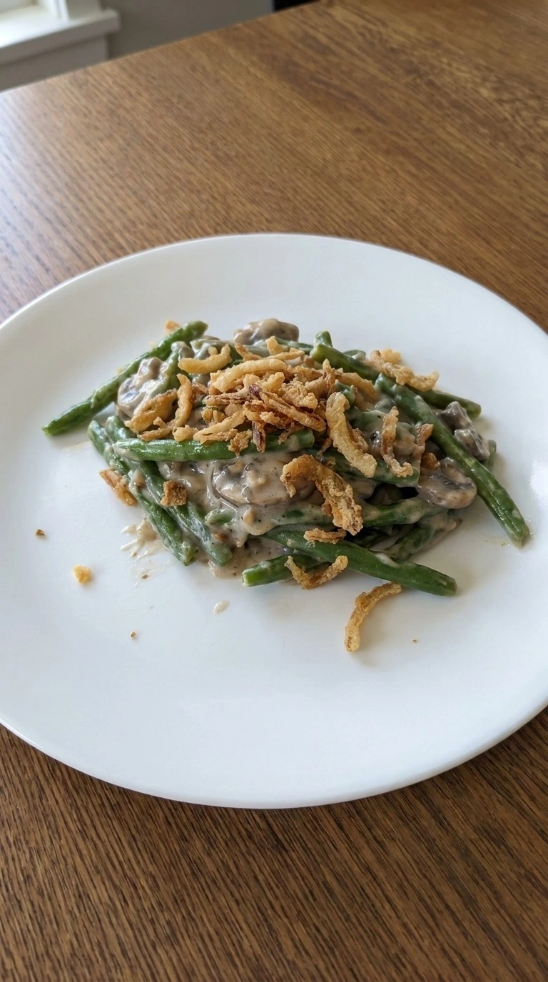 Green Bean Casserole with Fresh Green Beans plated single serving with crispy topping Recipe focus: green bean casserole with fresh beans.
