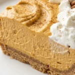 No Bake Pumpkin Cheesecake slice showing creamy pumpkin layers and crust Recipe focus: pumpkin cheesecake recipes.