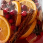 Non Alcoholic Christmas Punch with fruit slices and festive drink texture Recipe focus: christmas punch non alcoholic.