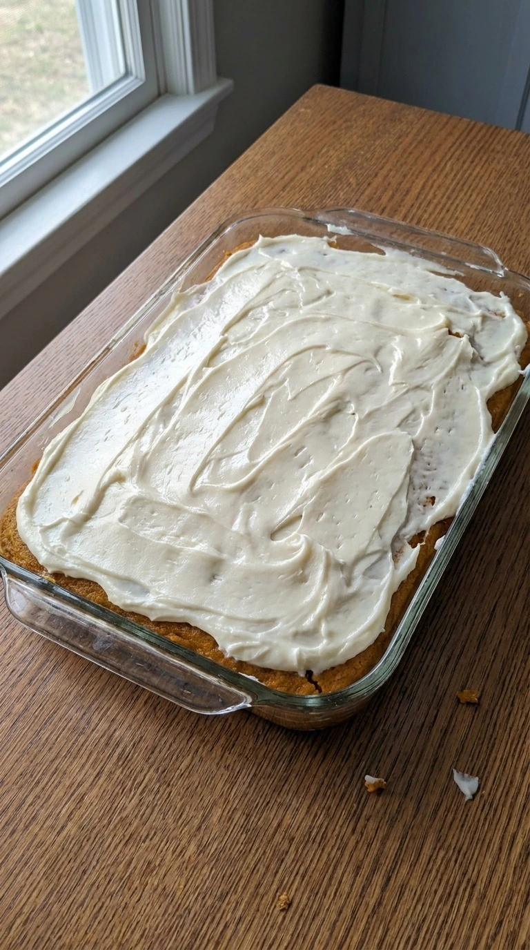 Pumpkin Bars with Cream Cheese Frosting creamy topping spread over cake Recipe focus: pumpkin bars recipe.