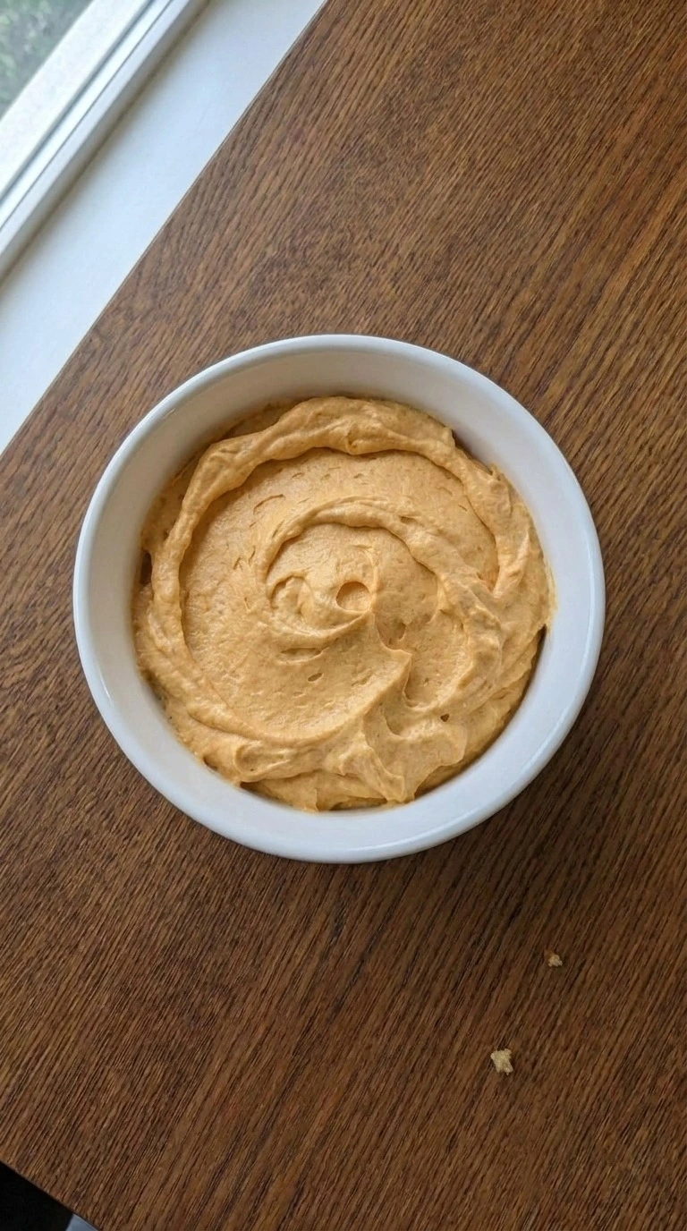 Pumpkin Pie Dip chilled in a serving bowl with thick creamy texture Recipe focus: pumpkin fluff dip.