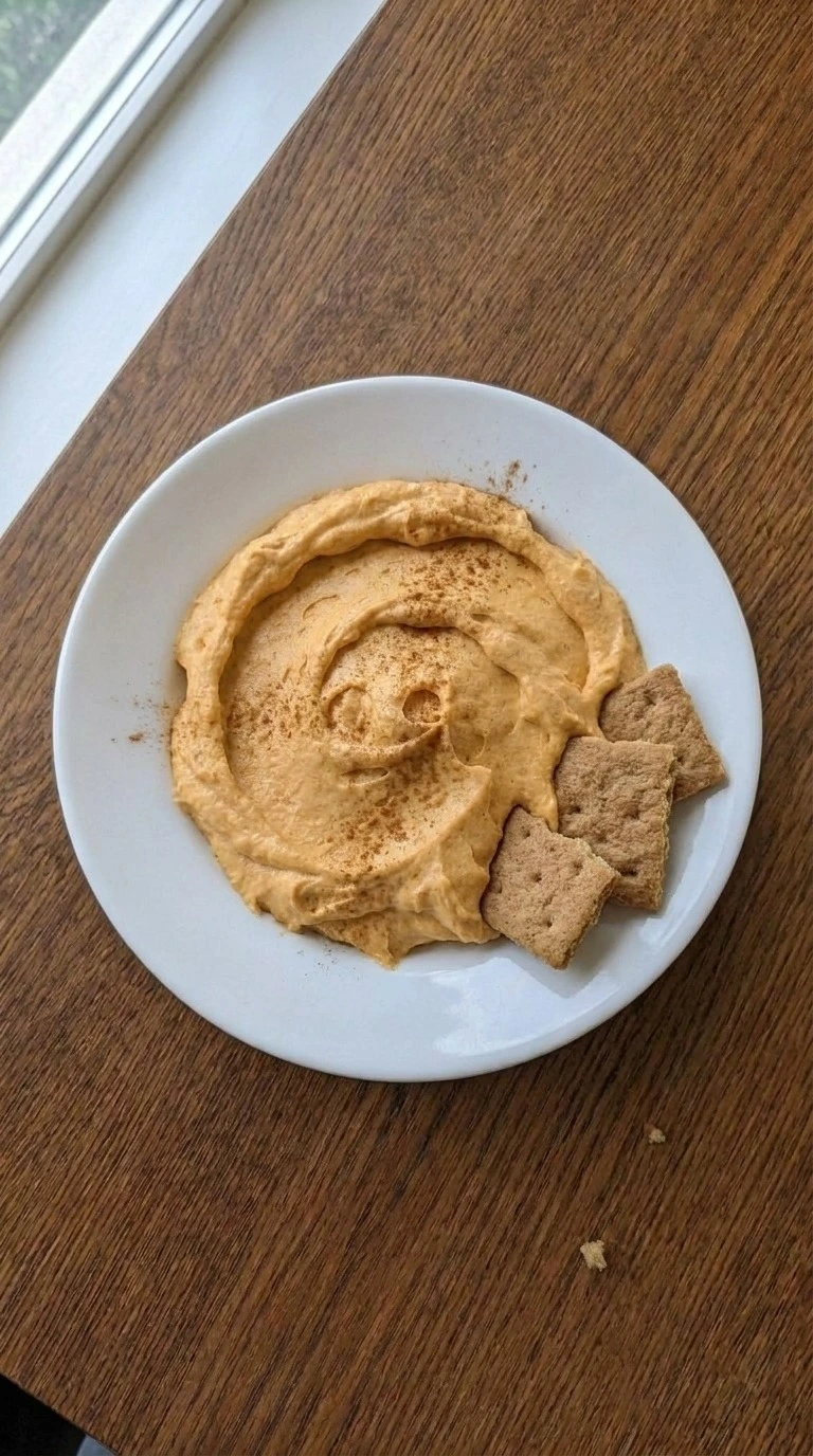 Pumpkin Pie Dip final serving with cinnamon topping and creamy texture Recipe focus: pumpkin dip with cream cheese.