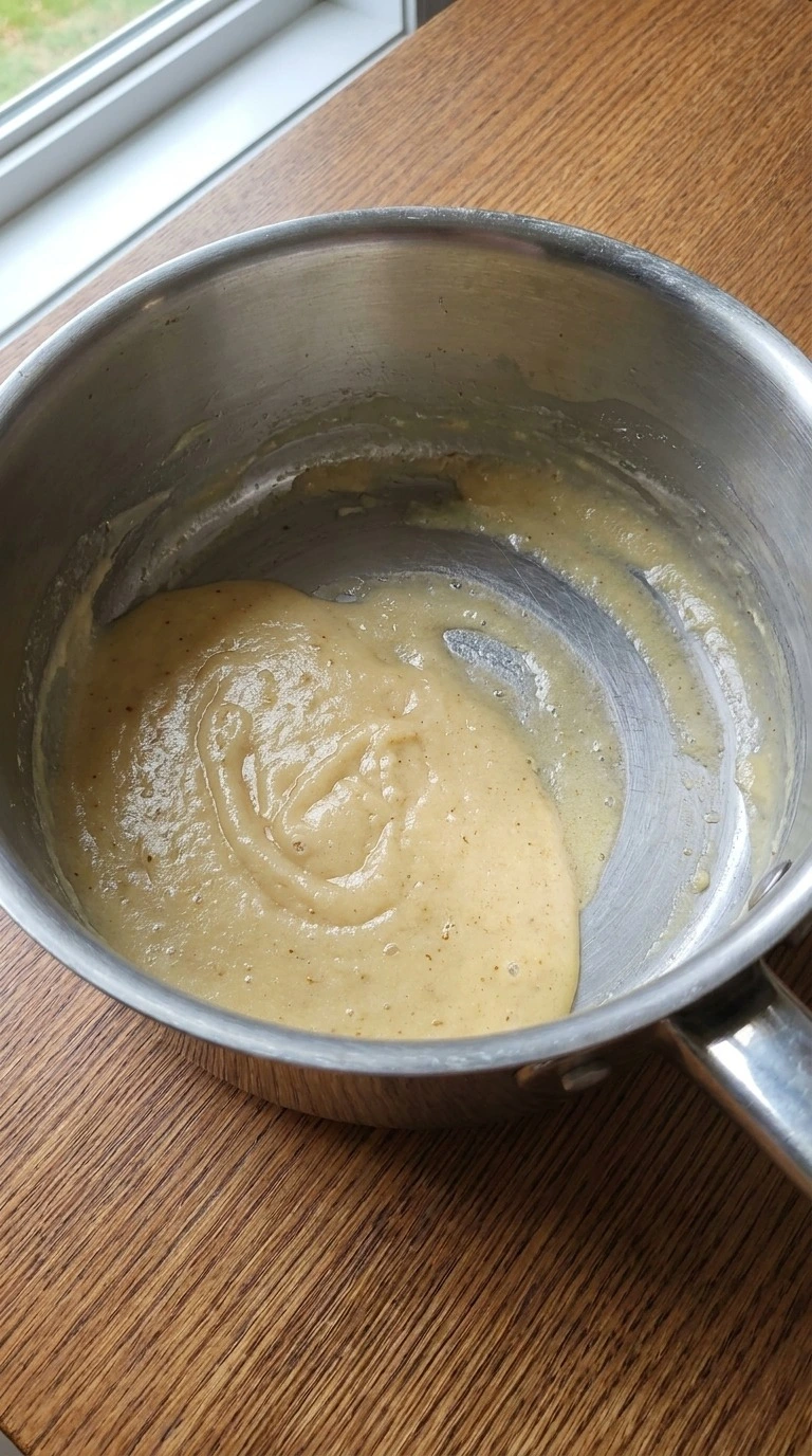 Turkey Gravy Without Drippings step one showing a pale golden butter and flour roux in a saucepan Recipe focus: easy turkey gravy without drippings.