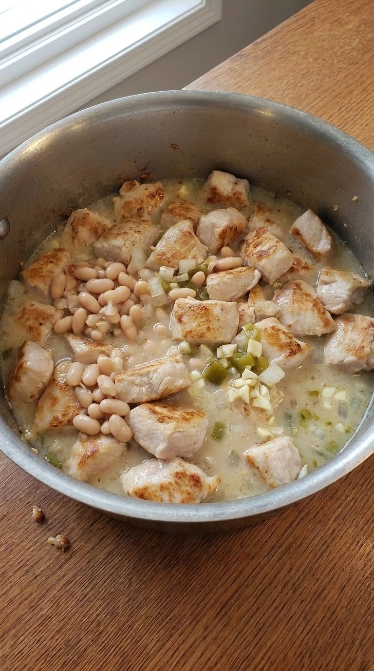 White Bean Chicken Chili ingredients combined with beans chicken and broth Recipe focus: white chicken chili.